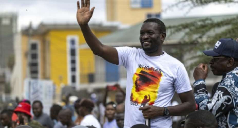 Sifuna drew roars of approval as he greeted supporters during a campaign rally in capital Nairobi.  By SIMON MAINA (AFP)