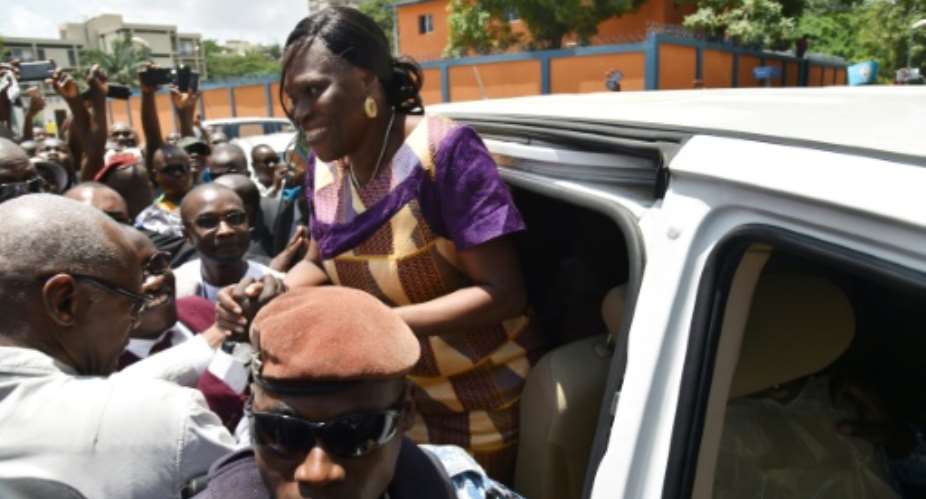 Simone Gbagbo arriving home in Abidjan on Wednesday following her amnesty.  By SIA KAMBOU AFPFile