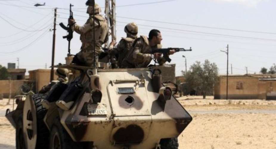 Egyptian soldiers are deployed in the area of the Rafah Crossing between Egypt and the Gaza Strip on May 21, 2013.  By  (AFP)