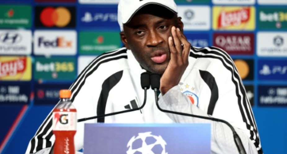 Slovan Bratislava coach Yaya Toure speaking to reporters in Paris on Tuesday.  By FRANCK FIFE (AFP)