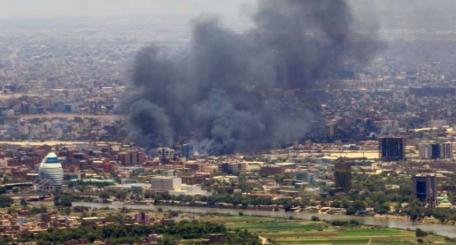 Smoke billows during fighting in the Sudanese capital Khartoum, on May 3, 2023.  By - AFPFile