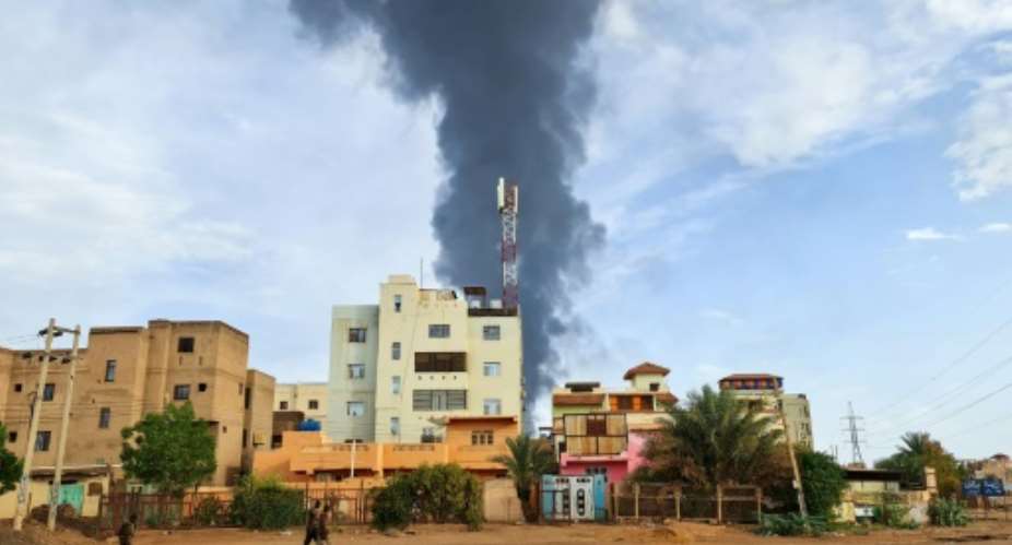 Smoke billows into the air over the Sudanese capital Khartoum as the fighting showed no let-up Friday.  By - AFP