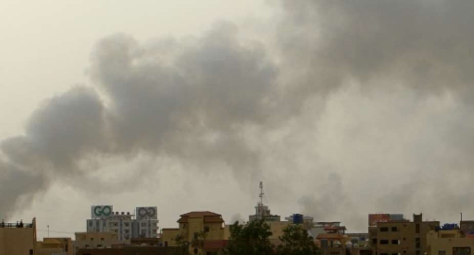 Smoke billows over buildings in southern Khartoum on May 29, 2023, amid ongoing fighting between the forces of two rival generals.  By - AFPFile
