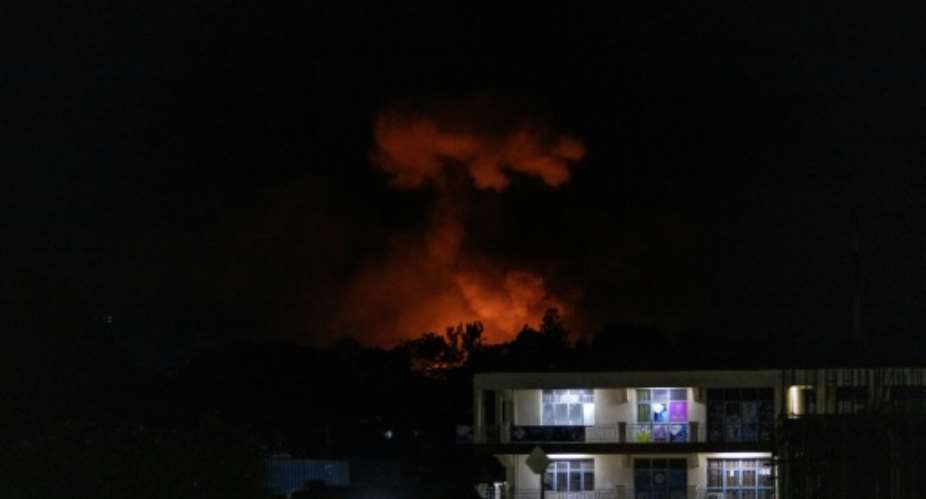 Smoke hung over part of Burundis economic capital Bujumbura after explosions erupted following a fire at a military arsenal.  By - (AFP)