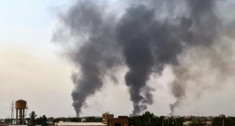 Smoke rises above buildings in Khartoum on May 24.  By - AFP