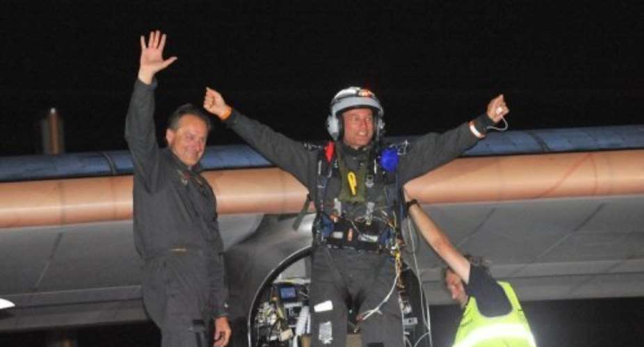 Bertrand Piccard right celebrates next to co-pilot Andre Borschberg after landing at Rabat Sale airport.  By Abdelhak Senna AFP