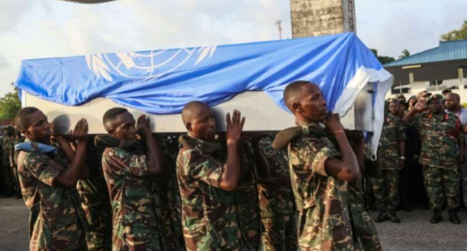 Soldiers carry the coffin of a Tanzanian peacekeeper in December 2017.  By  AFPFile