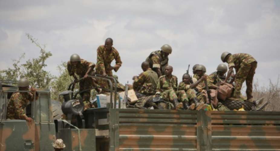 Soldiers of the Kenyan contingent serving with the African Union Mission in Somalia AMISOM load a truck as part of a resupply convoy in Dhobley, southern Somalia.  By STUART PRICE AU-UN IST PHOTOAFPFile
