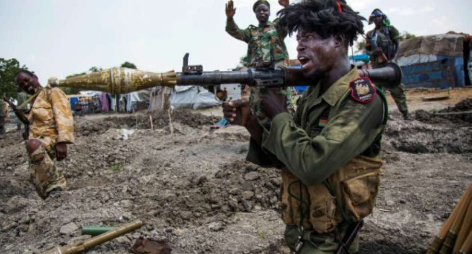 Soldiers of the Sudan People Liberation Army  are in Lelo, northern South Sudan, on October 16, 2016 after heavy fighting broke out two days earlier.  By Albert Gonzalez Farran AFPFile