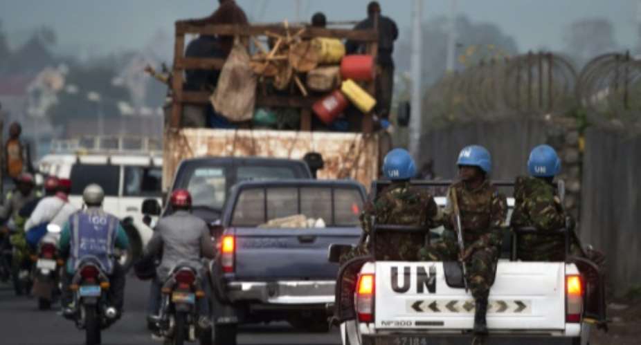Soldiers of the United Nations Organization Stabilization Mission in the Democratic Republic of the Congo patrol a street in Goma, Democratic Republic of Congo on April 21, 2016.  By Pablo Porciuncula AFPFile