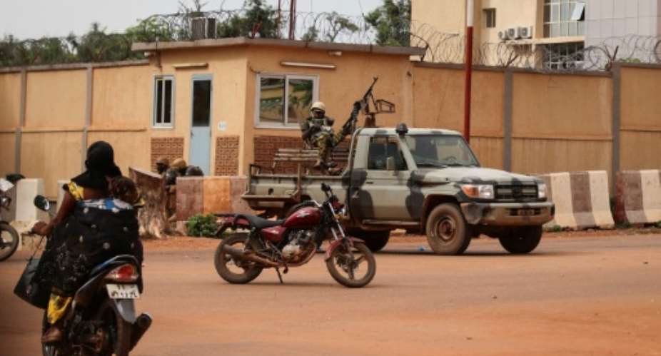 Soldiers patrol the streets of Ouagadougou after shots rang out during the morning.  By Olympia DE MAISMONT AFP
