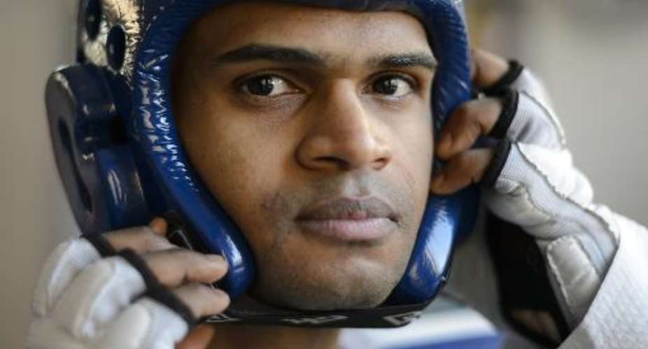 Faisal Jeylani Aweys fled his native Somalia 14 years ago and hopes his sport taekwondo could provide medals for the troubled country.  By Fabrice Cofrini (AFP)