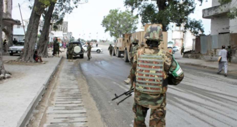 Soldiers of the African Union Mission in Somalia AMISOM secure an area near the Godka Jillicow prison in Mogadishu on August 31, 2014.  By Abdifitah Hashi Nor AFPFile