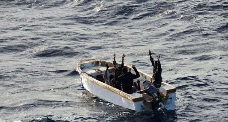 This handout picture released by the EU Navfor on January 13, 2012 shows six Somali men surrendering to members of the EU NAVFOR flagship, the ESPS Patino, off the coast of Mogadishu.  By  (EU Navfor/AFP/File)