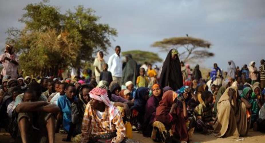 Somali refugees line-up at a registration centre at the Dagahaley refugee site in kenya, on August 2, 2011.  By Tony Karumba (AFP/File)