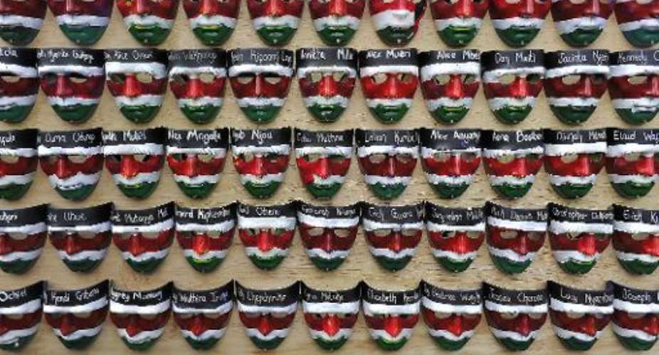 Masks with the names of the victims of the attack on Garissa University College are displayed during a memorial concert in downtown Nairobi on April 14,  2015.  By Simon Maina AFP