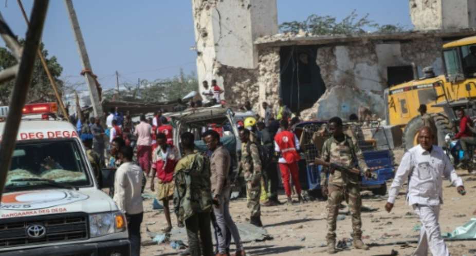 Somali soldiers secure the scene after a car bombing that killed at least 79 people in Mogadishu on December 28, 2019.  By Abdirazak Hussein FARAH AFPFile