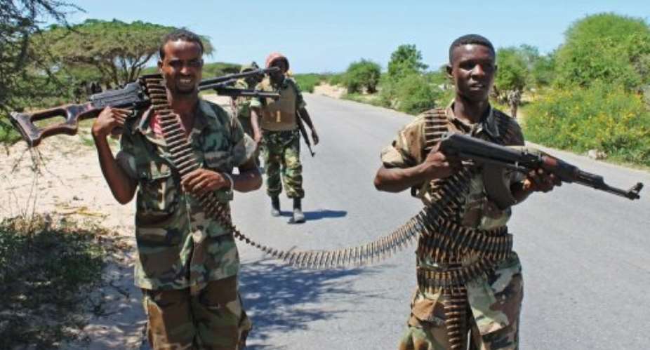 Somali soldiers patrol a stretch of road betwwen Mogadishu and Afgoye.  By Mohamed Abdiwahab AFPFile