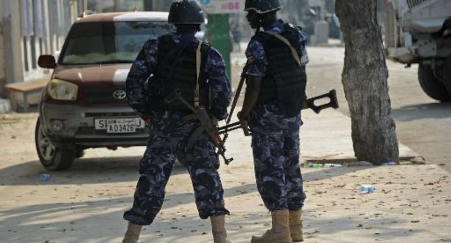 Security forces stand guard on March 28, 2015 after a bomb attack on March 27 on the Maka al Mukarama hotel in Mogadishu.  By Mohamed Abdiwahab AFP