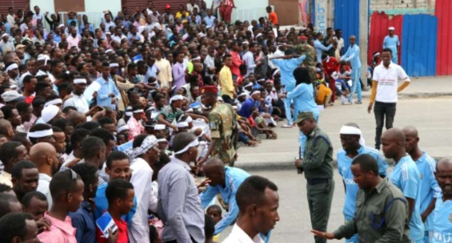 Somalis gather in the capital Mogadishu to commemorate the first anniversary of bombing attack that killed more than 500 people in one of the country's worst ever attacks.  By ABDIRAZAK HUSSEIN FARAH AFP
