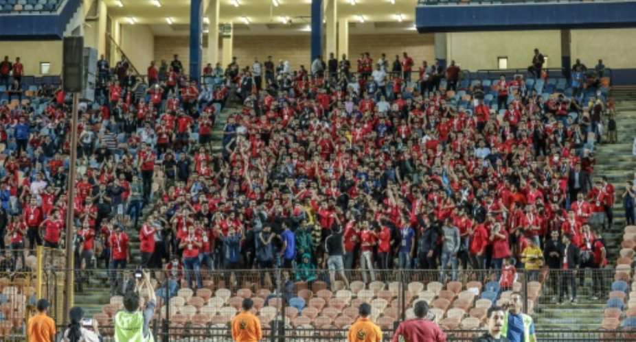 Some of the 1,000 Al Ahly fans allowed to watch the match at Cairo International Stadium, after a long absence.  By - AFP