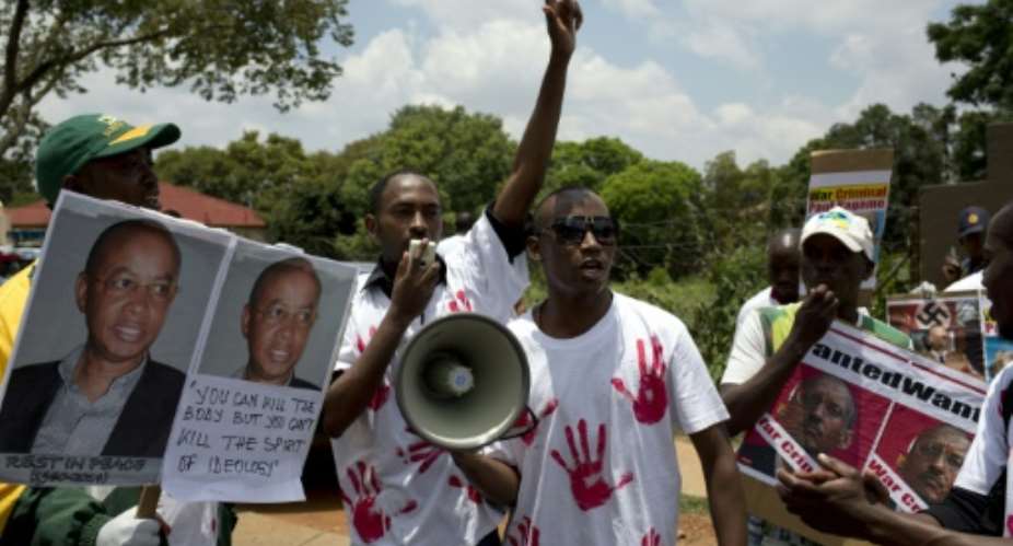 Sopporters of the Rwanda National Congress opposition party set up in exile protest in January 2014 at the murder of founding member Patrick Karegeya..  By ALEXANDER JOE AFPFile