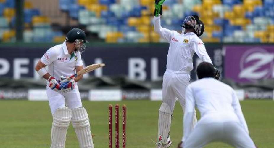 South Africa's Dean Elgar L is dismissed by Sri Lanka's Dilruwan Perera not pictured during the fifth and final day of the second Test in Colombo on July 28, 2014.  By Lakruwan Wanniarachchi AFP