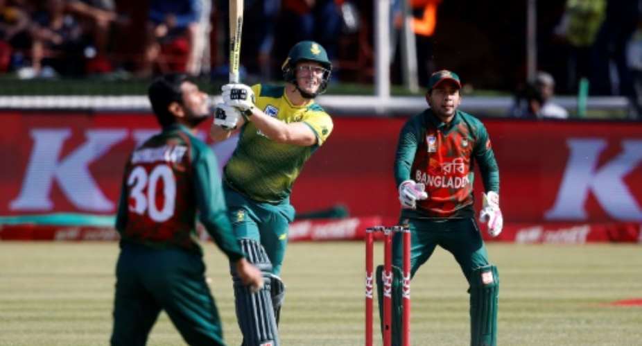 South Africa batsman David Miller (C) hits a six during the second T20 against Bangladesh in Potchefstroom, South Africa on October 29, 2017.  By GIANLUIGI GUERCIA (AFP)