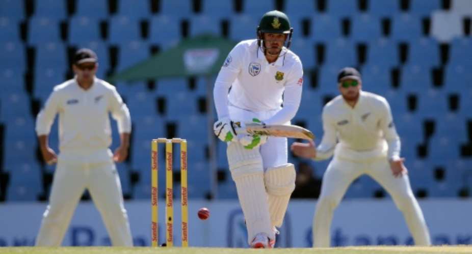 South Africa batsman Quinton De Kock centre plays a shot on the first day of the second Test against New Zealand in Centurion, South Africa on August 27, 2016.  By Gianluigi Guercia AFP