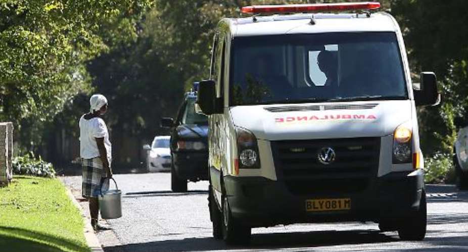 An ambulance drives down a road in Johannesburg on April 6, 2013.  By - AFPFile