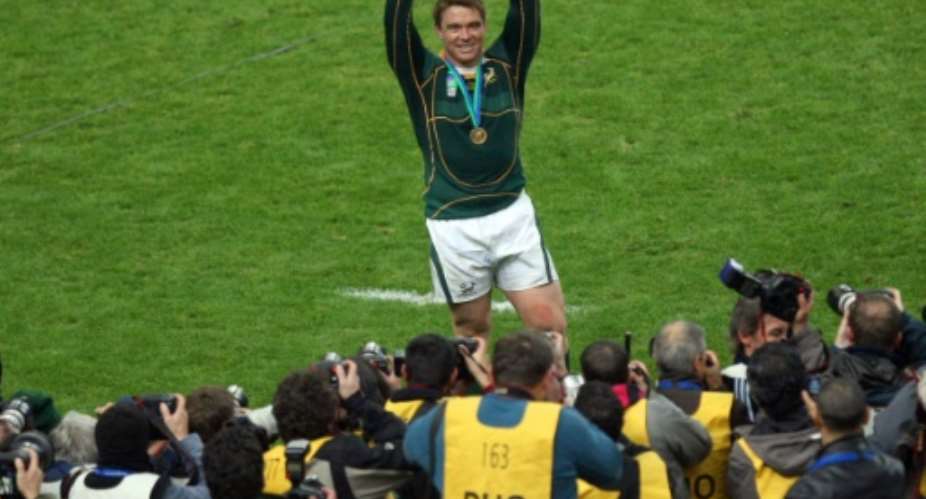South Africa captain John Smit holds the trophy after a 15-6 victory over England in the 2007 Rugby World Cup final in Paris.  By FRANCK FIFE AFP