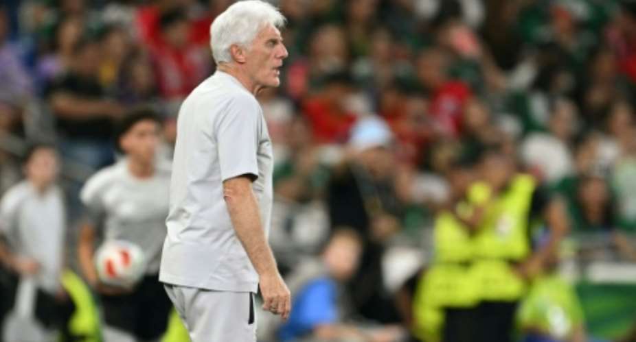 South Africa coach Hugo Broos watches the World Cup victory over South Korea..  By Yuri CORTEZ (AFP)
