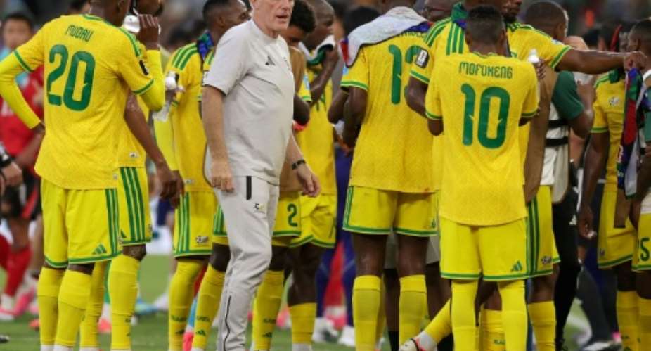 South Africa coach Hugo Broos with his players.  By Julio Cesar AGUILAR (AFP)