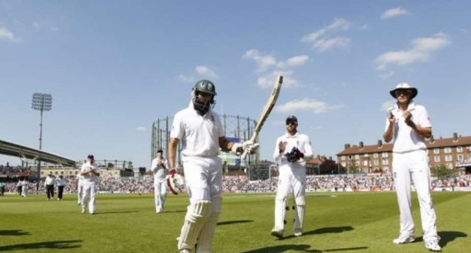 England players acknowledge Hashim Amla as he leaves the field at tea.  By Ian Kington (AFP)
