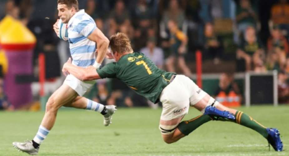 South Africa flanker Pieter-Steph du Toit R tackles Argentina full-back Juan Cruz Mallia during a Rugby Championship match in Durban on September 24, 2022..  By PHILL MAGAKOE AFP