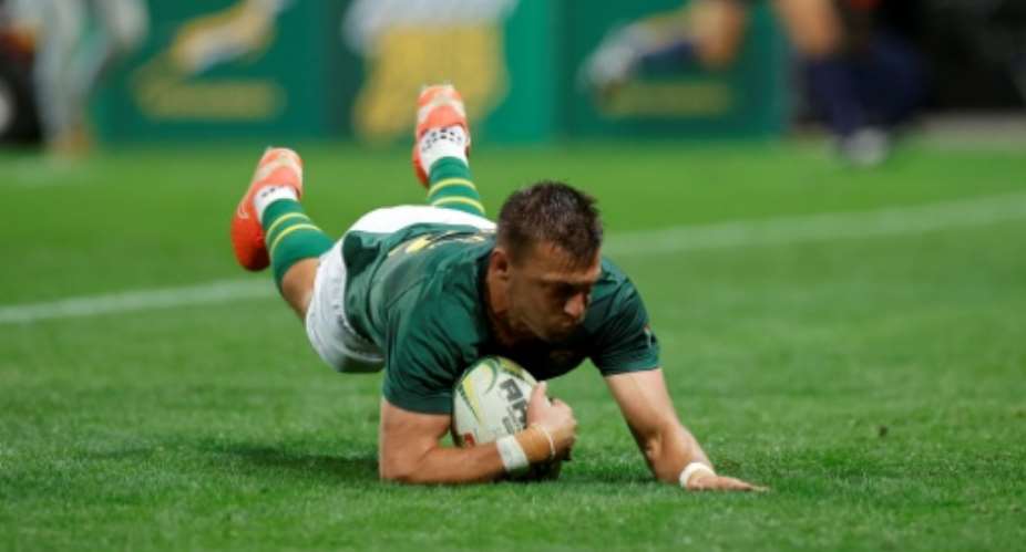 South Africa fly-half Handre Pollard scores a try against Georgia in Mbombela.  By PHILL MAGAKOE (AFP)