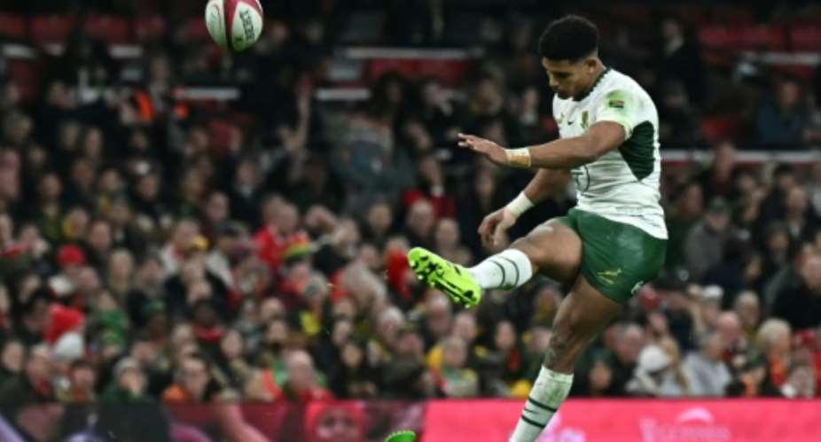 South Africa fly-half Sacha Feinberg-Mngomezulu kicks a conversion against Wales in Cardiff last season.  By Paul ELLIS (AFP/File)