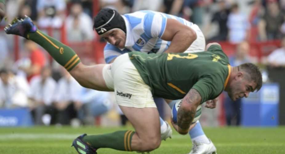 South Africa hooker Malcolm Marx front is tackled by Argentina lock Tomas Lavanini during a Rugby Championship match in  Buenos Aires on September 17, 2022..  By JUAN MABROMATA AFP