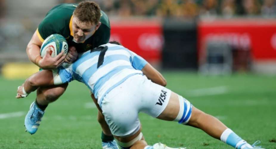 South Africa number 8 Jasper Wiese (L) in action againt Argentina in Mbombela last season.  By PHILL MAGAKOE (AFP)
