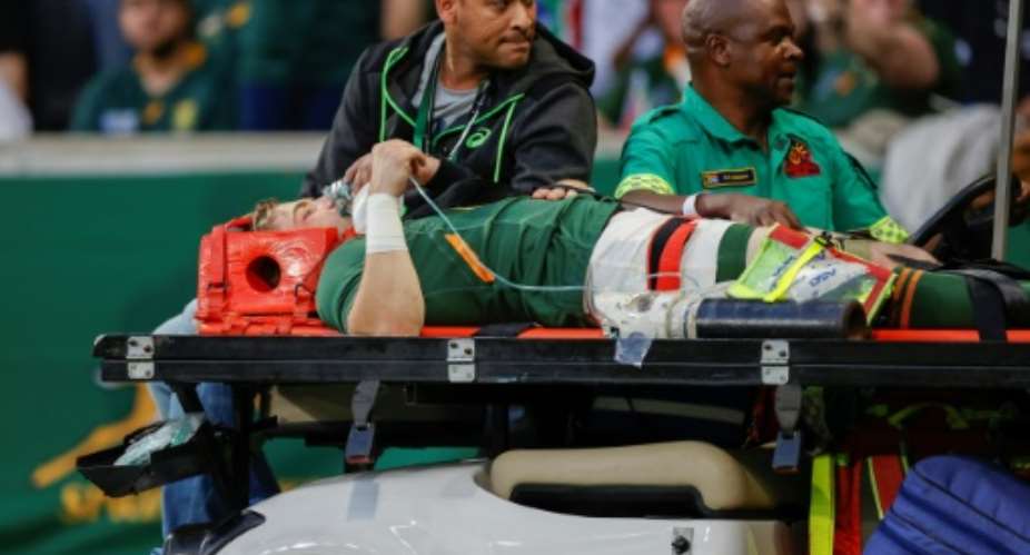 South Africa scrum-half Faf de Klerk is taken off on a stretcher after being injured during the Rugby Championship match against New Zealand in Mbombela on August 6, 2022..  By PHILL MAGAKOE AFP