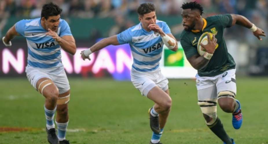 South Africa skipper Siya Kolisi R outpaces two Argentines during a Rugby World Cup warm-up match in Pretoria last month.  By Christiaan Kotze AFP