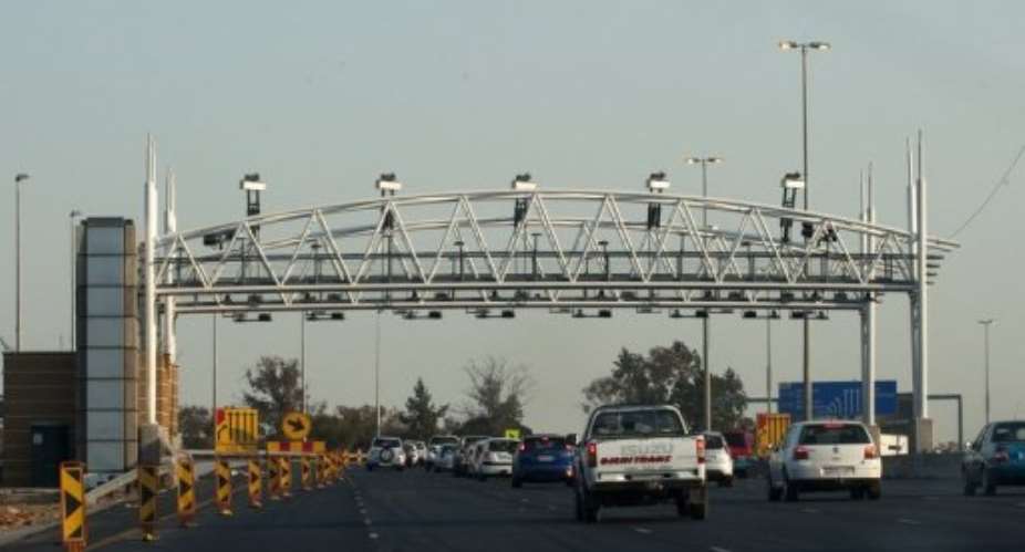 South African motorists drive towads an electronic toll plaza on the highway from Pretoria to Johannesburg in 2011.  By Alexander Joe (AFP/File)