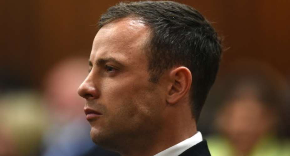 South African paralympian athlete Oscar Pistorius listening at the High Court in Pretoria on September 11, 2014.  By Phill Magakoe PoolAFPFile
