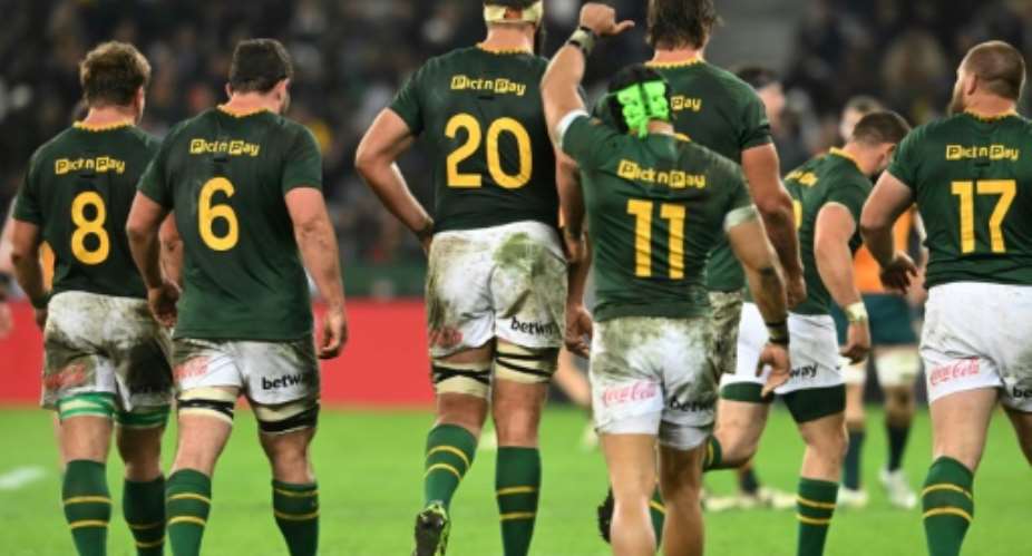 South Africa wing Cheslin Kolbe (3rd R) gives the thumbs up after the Boks beat Australia 30-22 in Cape Town.  By RODGER BOSCH (AFP)