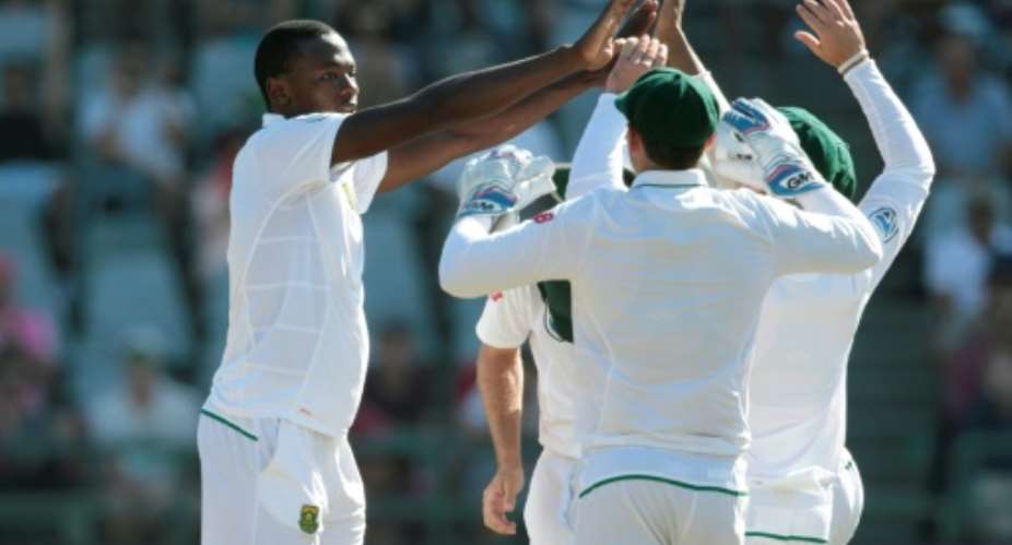 South African bowler Kagiso Rabada L celebrates the dismissal of Sri Lanka captain Angelo Mathews R during the second Test at Newlands Cricket Stadium in Cape Town on January 5, 2017.  By GIANLUIGI GUERCIA AFP