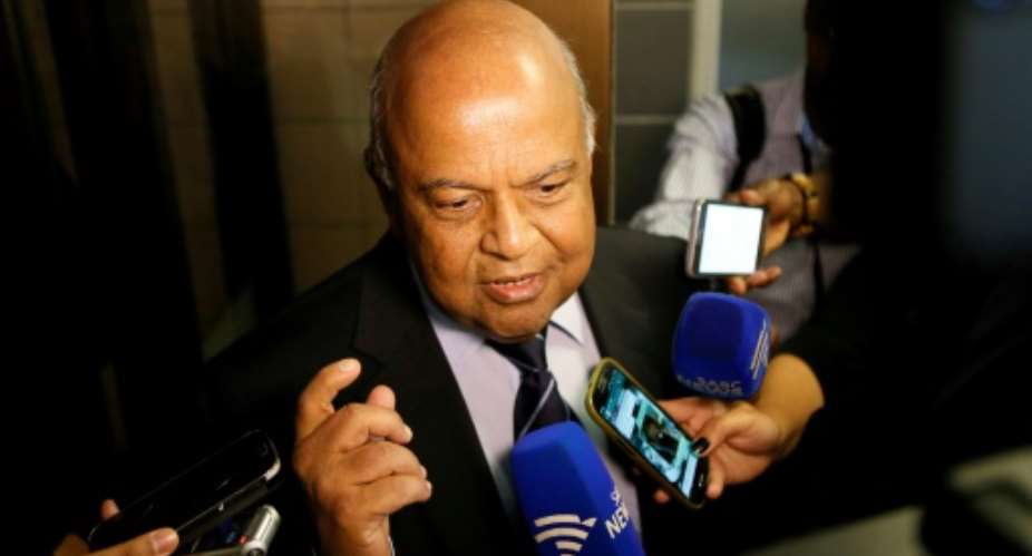 South African finance minister Pravin Gordhan speaks with journalists outside of the High Court on March 28, 2017 in Pretoria.  By Phil MAGAKOE AFP