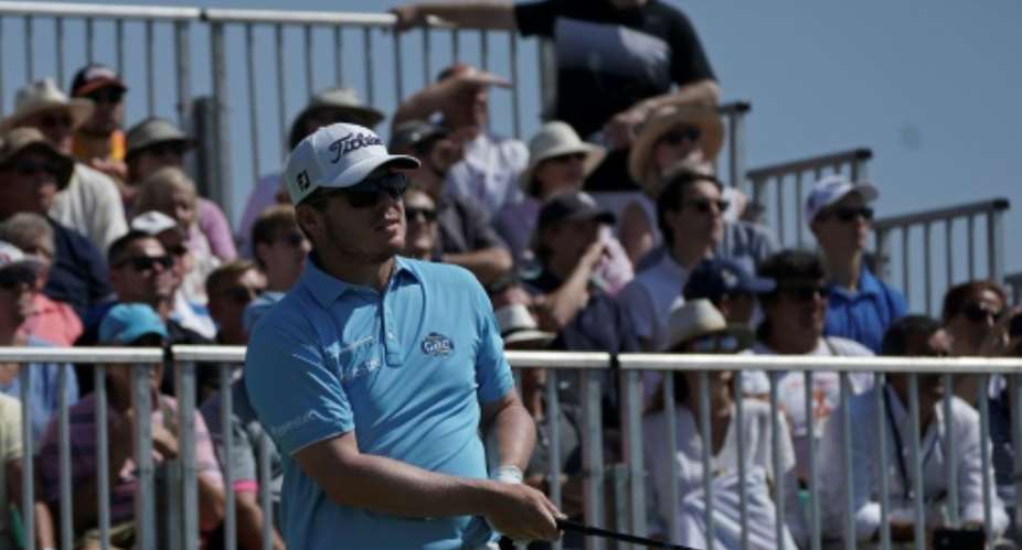 South African golfer George Coetzee, pictured on September 24, 2017, capped his round at Close House, Newcastle, sandwiching a sixth hole eagle in between six birdies and just one bogey.  By FRANCISCO LEONG (AFP/File)