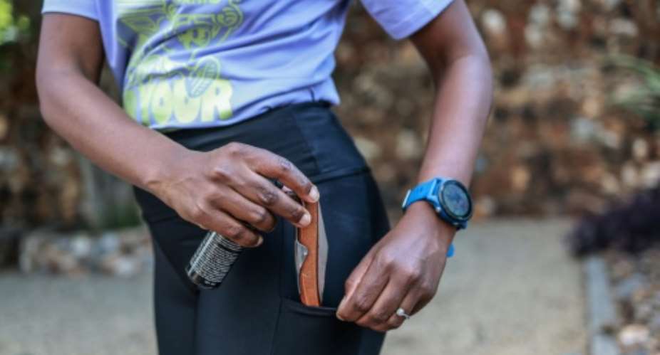 South African women are taking extra precautions when out exercising after the bodies of nine women were found, one of them a runner.  By PHILL MAGAKOE (AFP)