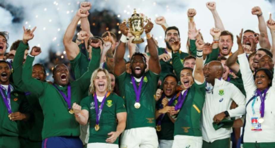 South Africa's captain Siya Kolisi lifts the Webb Ellis Cup after his side won the Rugby World Cup final against England a year ago in Japan.  By Odd ANDERSEN AFPFile