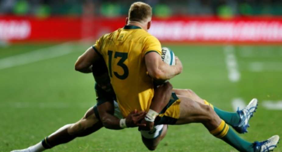 South Africa's defence withstood a second-half barrage from Reece Hodge and Australia.  By GIANLUIGI GUERCIA AFP